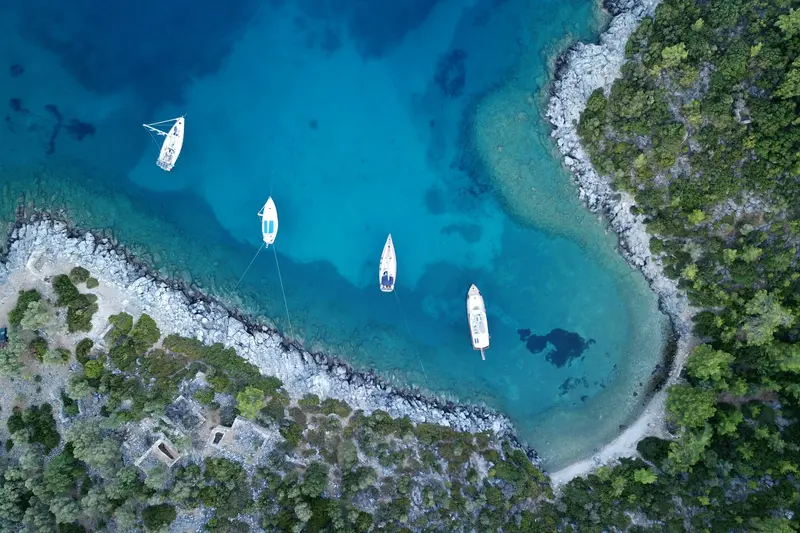 Boats anchored in a turquoise bay on the Bodrum peninsula, seen from above