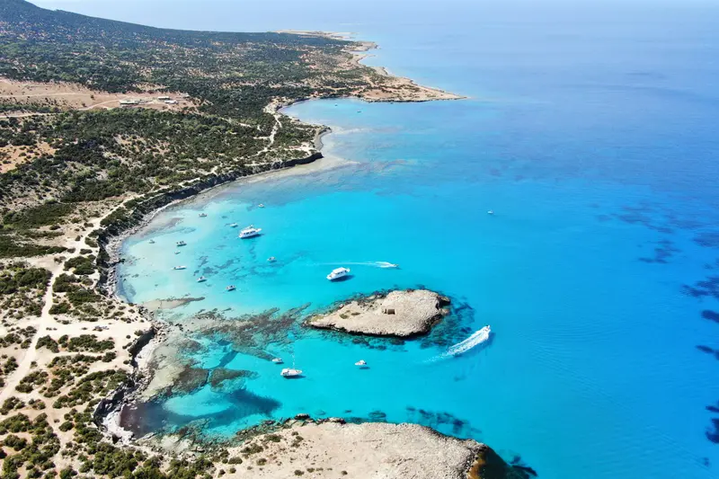 Turquoise water and a rocky coastline in Cyprus