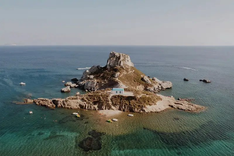The rocky islet of Kastri with its small chapel in clear sea off Kos