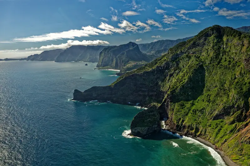 Green cliffs dropping into the Atlantic on Madeira