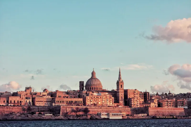 The domes and skyline of Valletta across the harbour in Malta