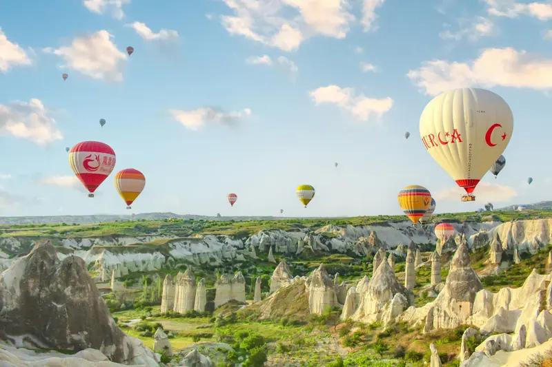 Hot air balloons over the rock valleys of Cappadocia in Turkey
